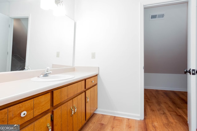 5491 Hiram Rd, Powder Springs, GA 30127 - bathroom featuring wood finished floors and vanity
