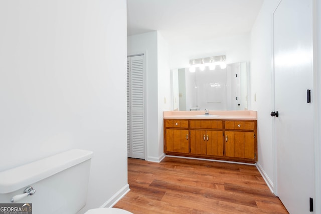 5491 Hiram Rd, Powder Springs, GA 30127 - bathroom featuring a closet, wood finished floors, and vanity