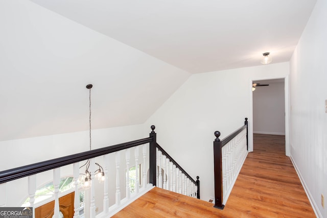 5491 Hiram Rd, Powder Springs, GA 30127 - hall with an upstairs landing, light wood-type flooring, and lofted ceiling