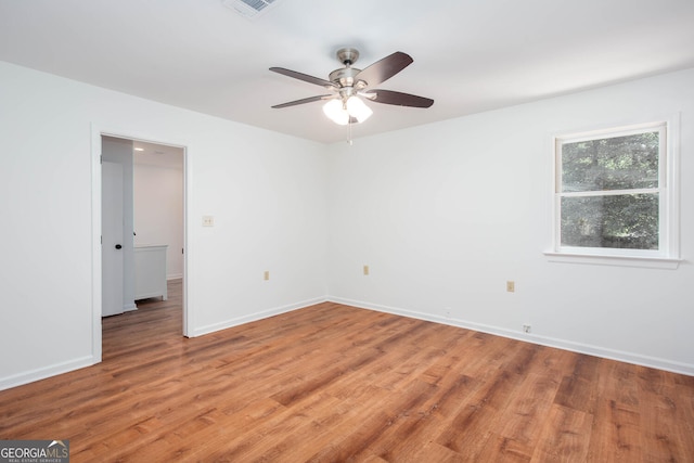 5491 Hiram Rd, Powder Springs, GA 30127 - spare room featuring light wood-style flooring and a ceiling fan