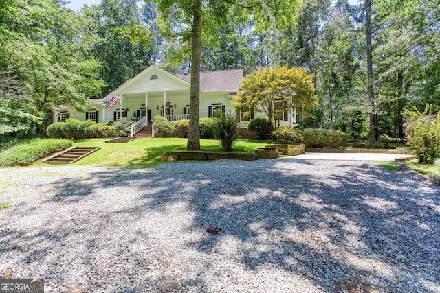 5491 Hiram Rd, Powder Springs, GA 30127 - view of front of property with covered porch, a front lawn, and stairs