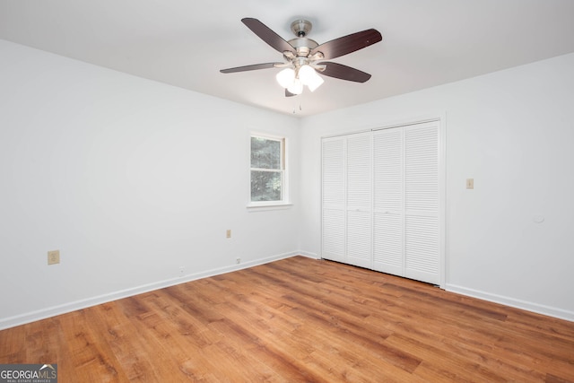 5491 Hiram Rd, Powder Springs, GA 30127 - unfurnished bedroom with light wood-style floors, a closet, and ceiling fan