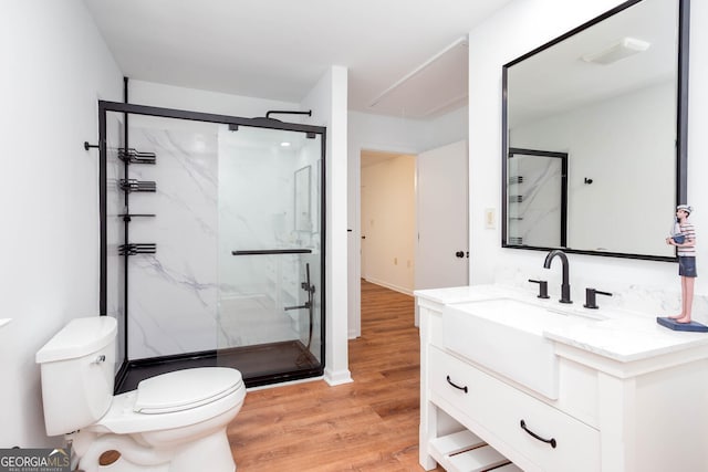 5491 Hiram Rd, Powder Springs, GA 30127 - full bathroom with vanity, a marble finish shower, and wood finished floors