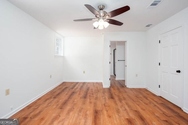 5491 Hiram Rd, Powder Springs, GA 30127 - unfurnished bedroom with light wood-style floors and a ceiling fan
