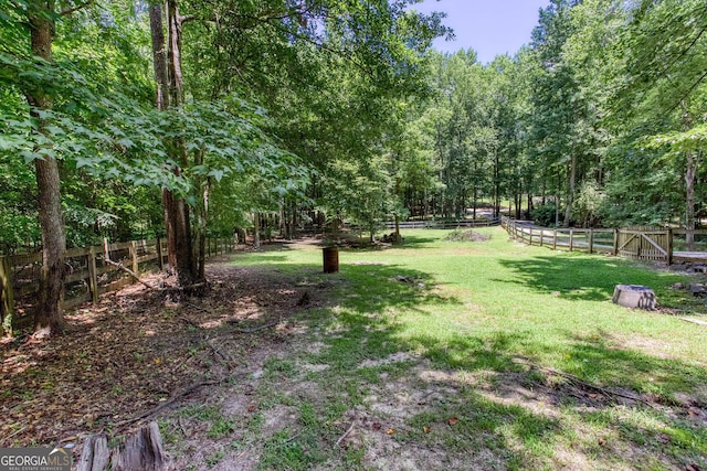 5491 Hiram Rd, Powder Springs, GA 30127 - fenced backyard featuring a wooded view
