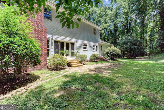 5491 Hiram Rd, Powder Springs, GA 30127 - rear view of house with a yard
