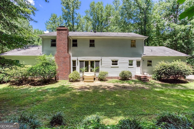 5491 Hiram Rd, Powder Springs, GA 30127 - rear view of house featuring a chimney and a yard