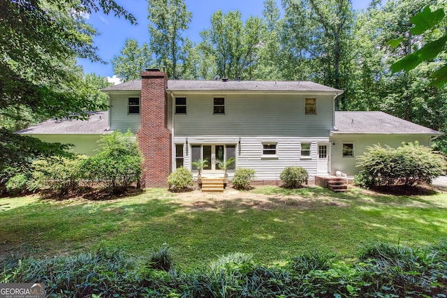 5491 Hiram Rd, Powder Springs, GA 30127 - rear view of property with a chimney and a yard