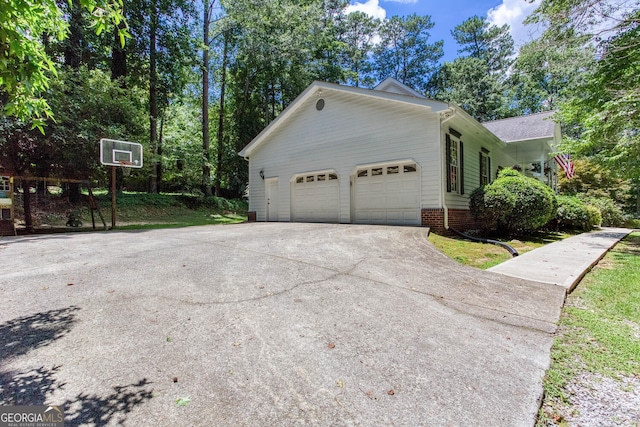 5491 Hiram Rd, Powder Springs, GA 30127 - view of home's exterior with a garage and concrete driveway