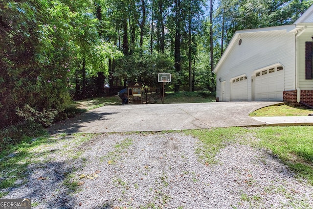 5491 Hiram Rd, Powder Springs, GA 30127 - view of property exterior featuring concrete driveway and a garage