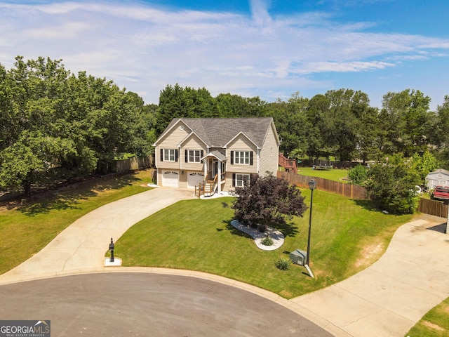 432 Nicole Ct, Winder, GA 30680 - bi-level home with a garage, concrete driveway, and view of wooded area