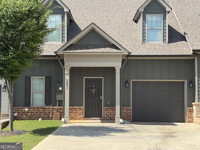 3891 Valley View Ct, Gainesville, GA 30501 - view of front of home with board and batten siding, concrete driveway, roof with shingles, and brick siding