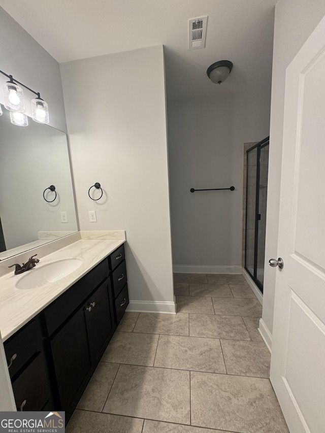 3891 Valley View Ct, Gainesville, GA 30501 - bathroom featuring vanity, a shower stall, and tile patterned flooring