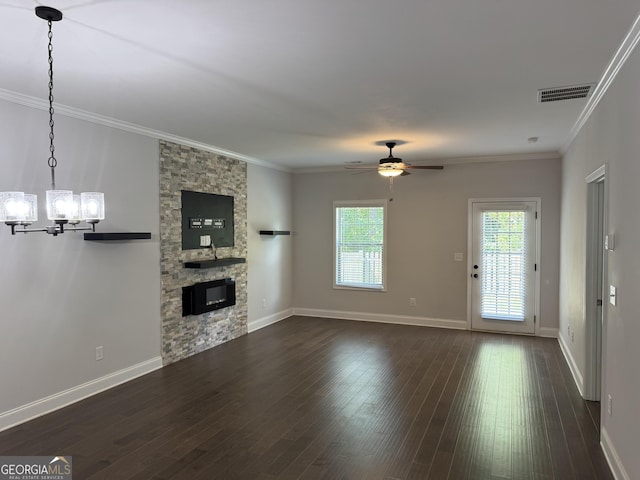 3891 Valley View Ct, Gainesville, GA 30501 - unfurnished living room with a fireplace, a chandelier, ornamental molding, ceiling fan, and dark wood-type flooring