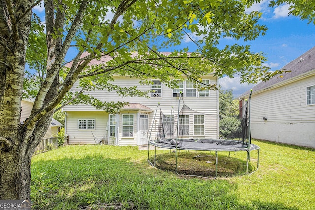 485 Greyhawk Way, Fairburn, GA 30213 - back of property featuring a trampoline