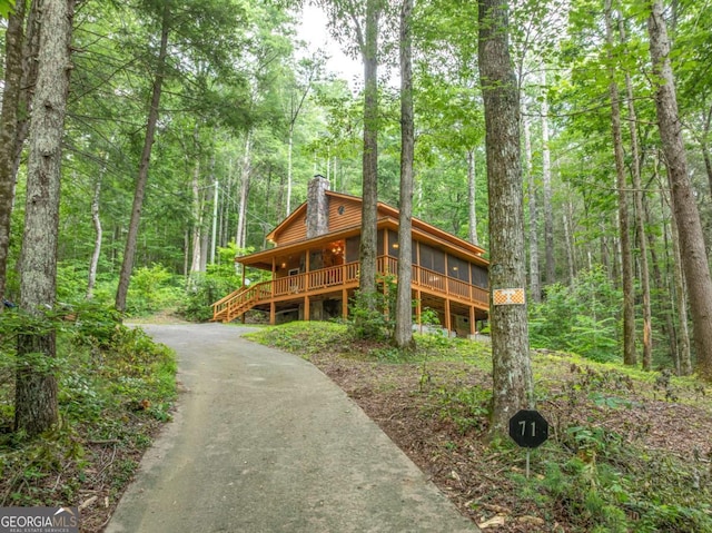 71 Cohutta Forest Rd Unit 9, Chatsworth, GA 30705 - chalet / cabin with a chimney, a view of trees, driveway, and faux log siding