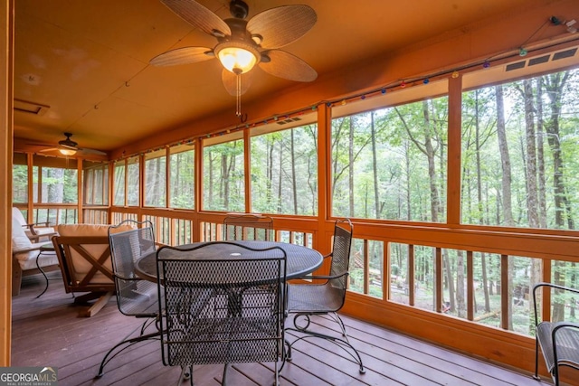 71 Cohutta Forest Rd Unit 9, Chatsworth, GA 30705 - sunroom / solarium with ceiling fan, outdoor dining space, and a wooded view