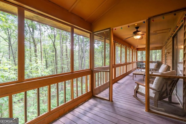 71 Cohutta Forest Rd Unit 9, Chatsworth, GA 30705 - unfurnished sunroom featuring vaulted ceiling, ceiling fan, and a view of trees