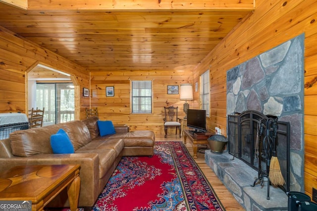 71 Cohutta Forest Rd Unit 9, Chatsworth, GA 30705 - living area with wood walls, wood finished floors, a stone fireplace, and wooden ceiling