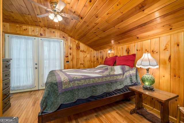 71 Cohutta Forest Rd Unit 9, Chatsworth, GA 30705 - bedroom featuring lofted ceiling, hardwood / wood-style floors, wooden ceiling, wood walls, and french doors
