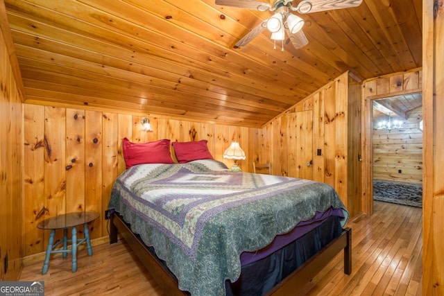 71 Cohutta Forest Rd Unit 9, Chatsworth, GA 30705 - bedroom with lofted ceiling, wooden walls, wooden ceiling, and hardwood / wood-style floors