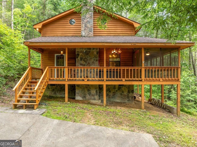 71 Cohutta Forest Rd Unit 9, Chatsworth, GA 30705 - view of front facade featuring stone siding, a shingled roof, a forest view, and stairway
