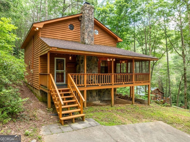 71 Cohutta Forest Rd Unit 9, Chatsworth, GA 30705 - chalet / cabin featuring roof with shingles, a chimney, a porch, stairs, and a view of trees