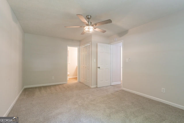 356 Waterway Trl, Powder Springs, GA 30127 - unfurnished bedroom with light colored carpet, ensuite bathroom, and ceiling fan