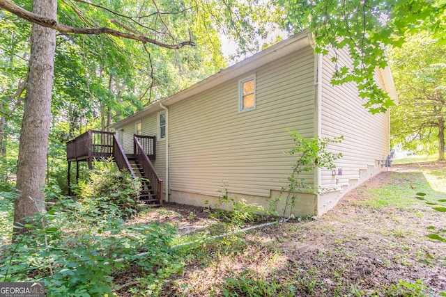 356 Waterway Trl, Powder Springs, GA 30127 - view of side of home with stairs and a wooden deck