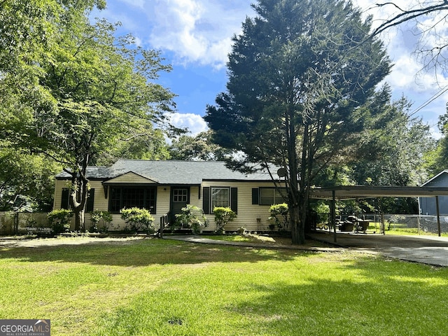 705 Princess Ave, Fort Valley, GA 31030 - ranch-style house with a carport and driveway