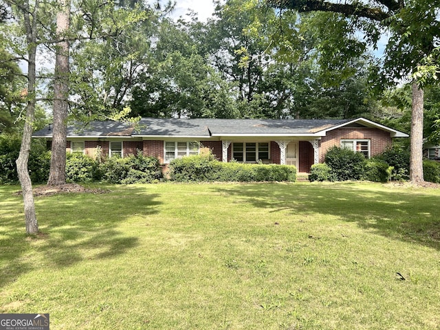 1406 Knoxville St, Fort Valley, GA 31030 - ranch-style home featuring brick siding and a front yard