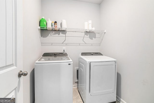 154 Laurel Cove Dr, Hoschton, GA 30548 - laundry room with independent washer and dryer and baseboards