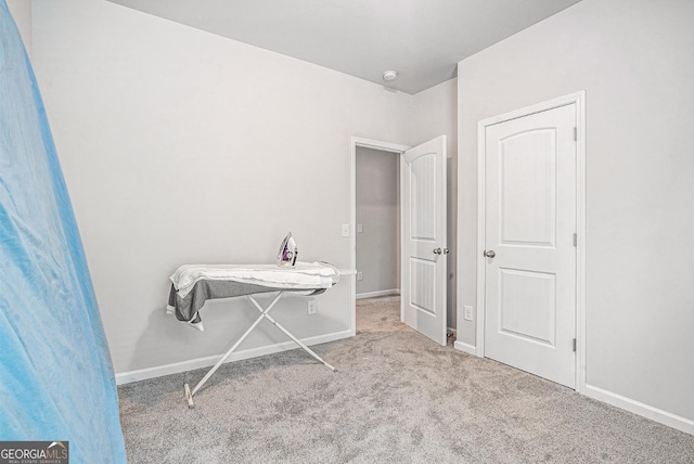 154 Laurel Cove Dr, Hoschton, GA 30548 - carpeted bedroom featuring baseboards