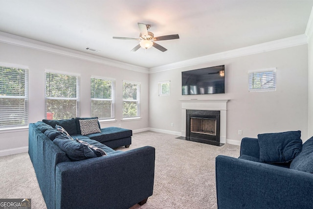 154 Laurel Cove Dr, Hoschton, GA 30548 - carpeted living area with crown molding, ceiling fan, plenty of natural light, and a fireplace