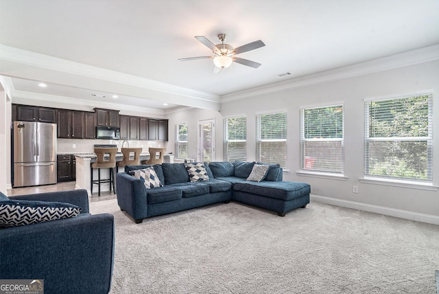 154 Laurel Cove Dr, Hoschton, GA 30548 - living room with healthy amount of natural light, crown molding, a ceiling fan, light carpet, and recessed lighting