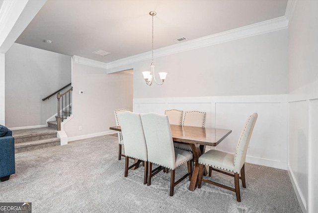 154 Laurel Cove Dr, Hoschton, GA 30548 - dining area featuring ornamental molding, a chandelier, carpet flooring, stairway, and wainscoting
