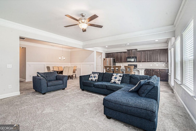 154 Laurel Cove Dr, Hoschton, GA 30548 - living area featuring light colored carpet, ornamental molding, a ceiling fan, and a chandelier