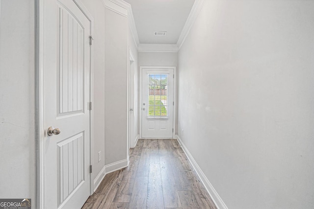 154 Laurel Cove Dr, Hoschton, GA 30548 - doorway to outside featuring light wood-type flooring and ornamental molding