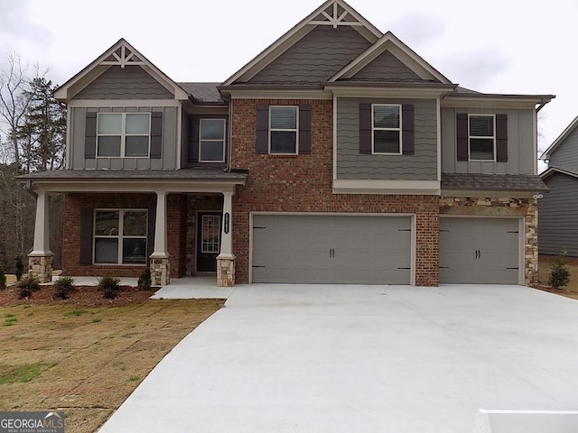 1741 Cobblefield Cir, Dacula, GA 30019 - craftsman inspired home with a garage, driveway, covered porch, board and batten siding, and brick siding