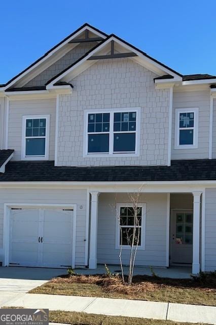 322 Heron St, Ball Ground, GA 30107 - view of front of home featuring an attached garage, a porch, and driveway
