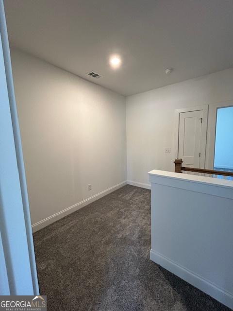 322 Heron St, Ball Ground, GA 30107 - unfurnished room with dark colored carpet and a smoke detector