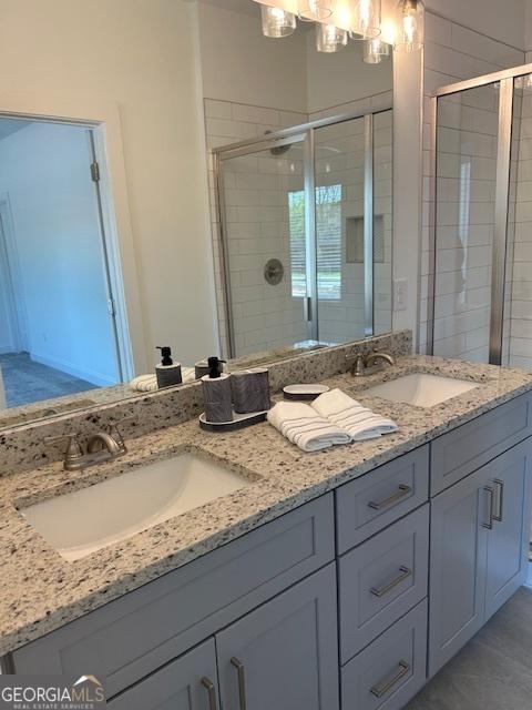 322 Heron St, Ball Ground, GA 30107 - bathroom featuring double vanity and a shower stall