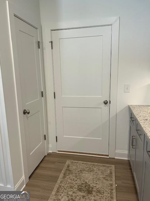 322 Heron St, Ball Ground, GA 30107 - doorway to outside with dark wood-type flooring and baseboards