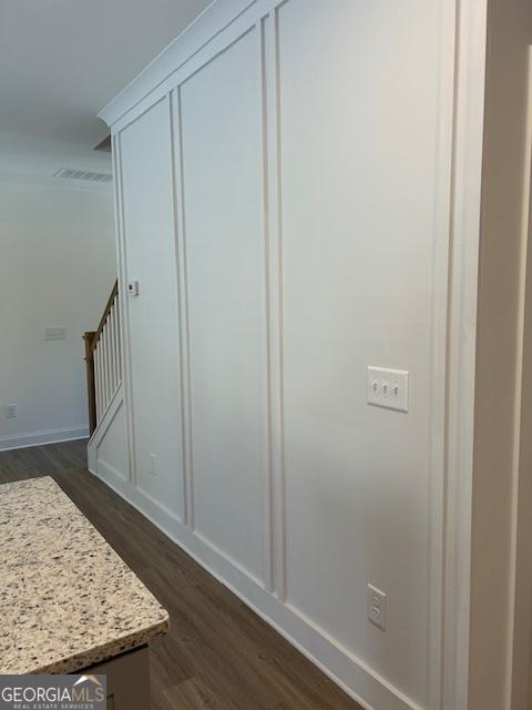 322 Heron St, Ball Ground, GA 30107 - detailed view of wood finished floors and baseboards