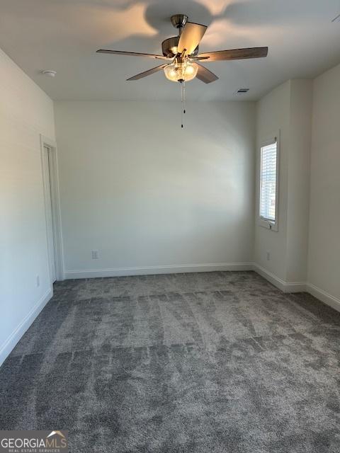 322 Heron St, Ball Ground, GA 30107 - carpeted spare room featuring ceiling fan and baseboards