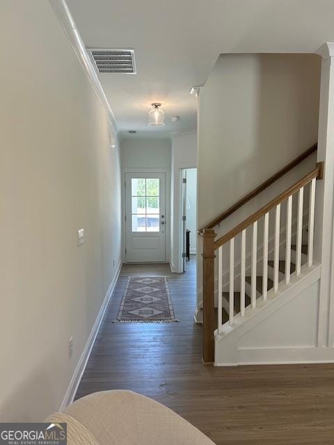 322 Heron St, Ball Ground, GA 30107 - entryway with wood finished floors, stairway, and crown molding