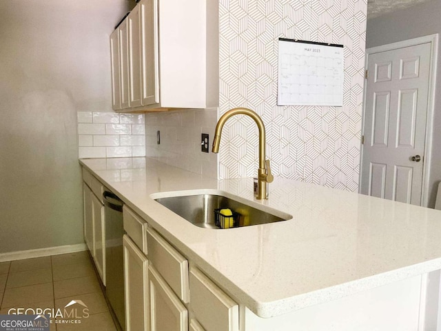 5553 Strathmoor Manor Cir, Lithonia, GA 30058 - kitchen with tasteful backsplash, light tile patterned flooring, light stone counters, and a peninsula