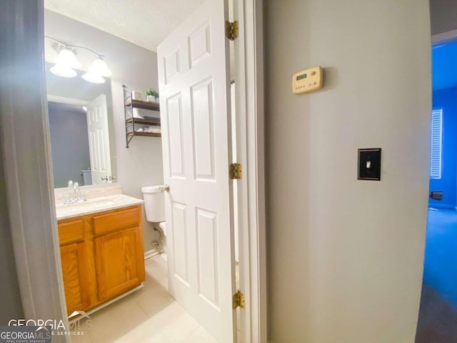 5553 Strathmoor Manor Cir, Lithonia, GA 30058 - half bathroom featuring vanity and tile patterned floors