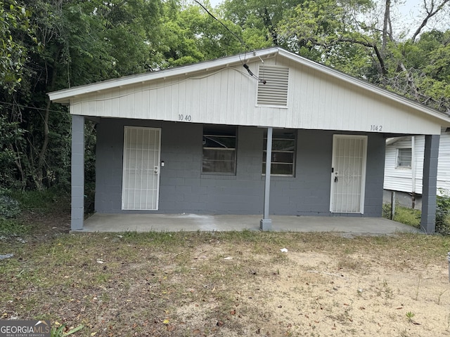 1040 Chestney St, Macon, GA 31217 - bungalow-style home with covered porch and concrete block siding