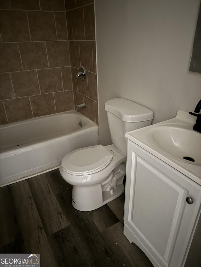 1040 Chestney St, Macon, GA 31217 - bathroom featuring vanity, bathing tub / shower combination, and wood finished floors
